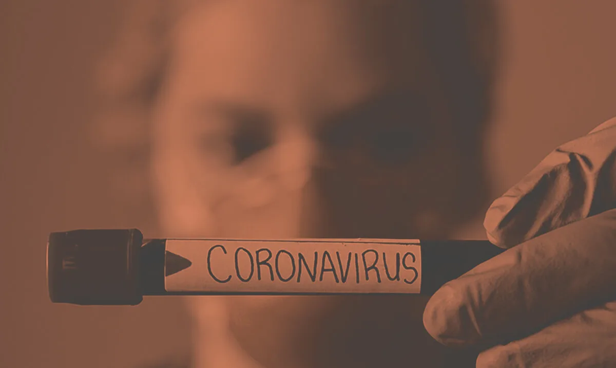 Blood vial with word coronavirus written on it