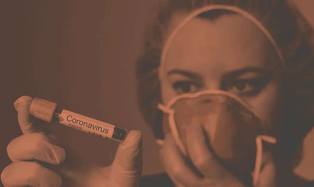 nurse holding coronavirus test
