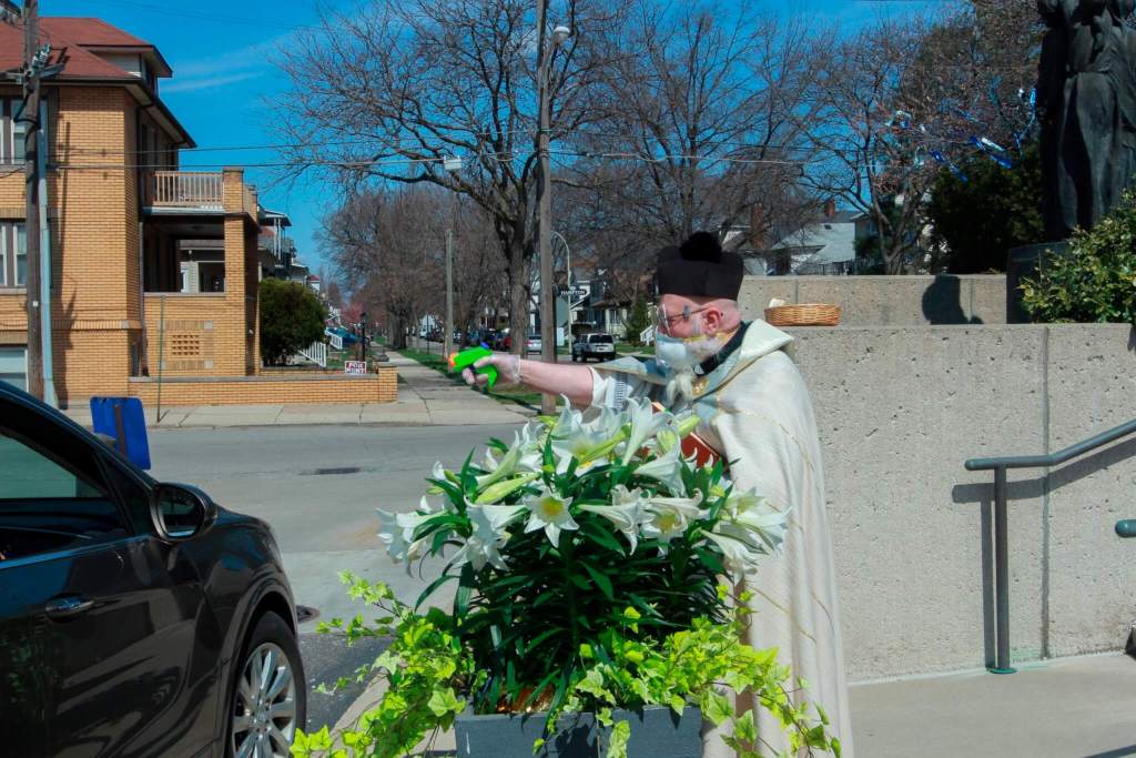 Here’s How One Priest Is Blessing His Flock With a Holy Water Squirt Gun