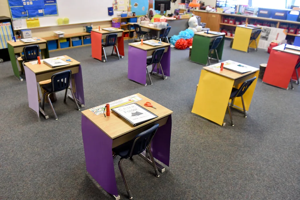 empty classroom with desks socially distanced