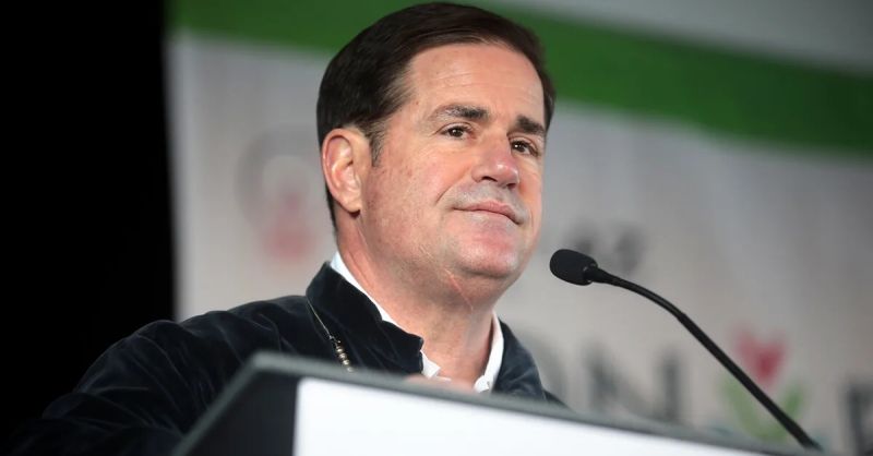 Doug Ducey stabding at podium