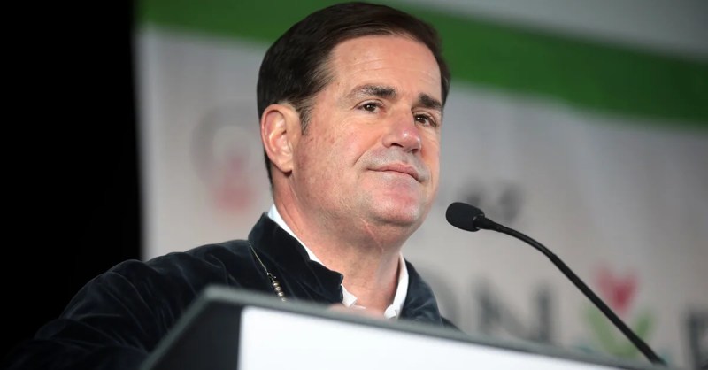 Doug Ducey stabding at podium