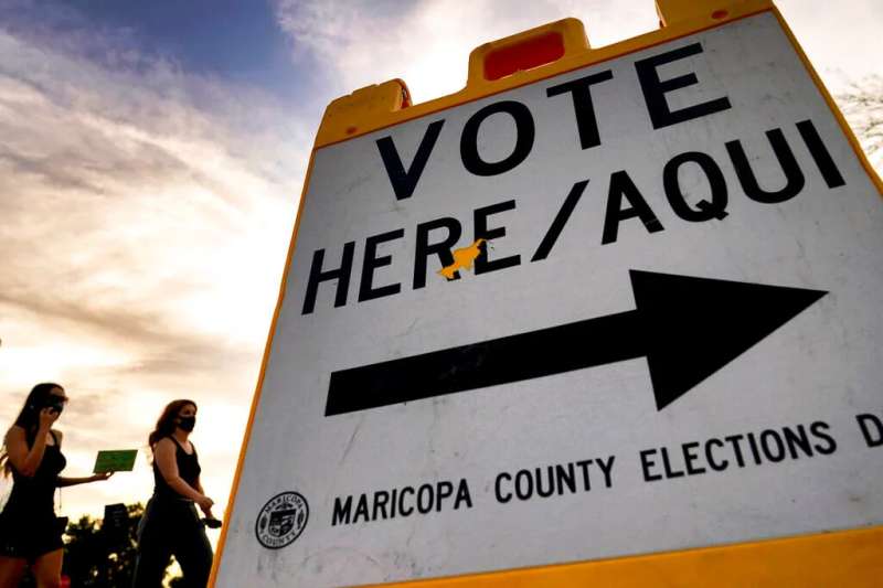 close up of "Vote Here" sign