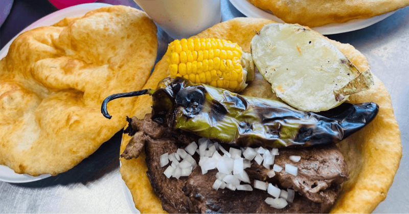 table with fry bread and Native tacos