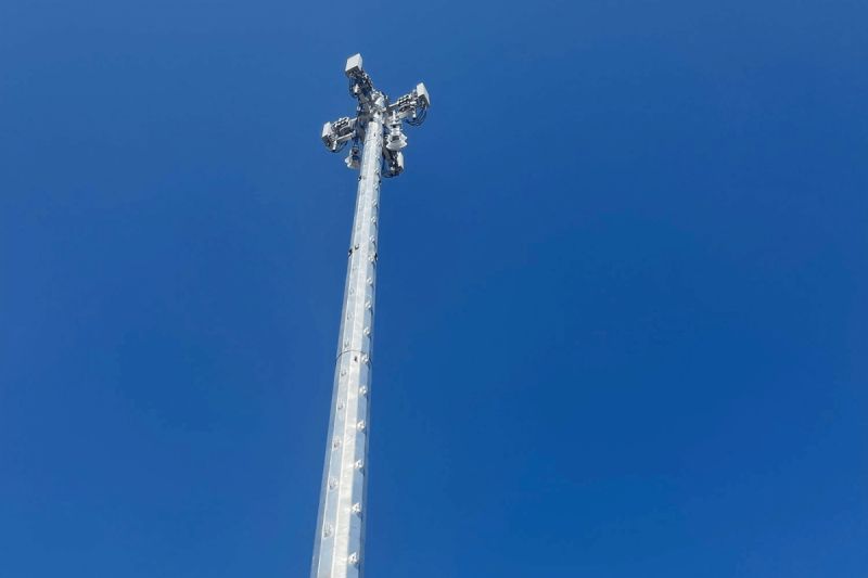 tall white poll extending into blue sky