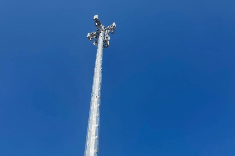 tall white poll extending into blue sky