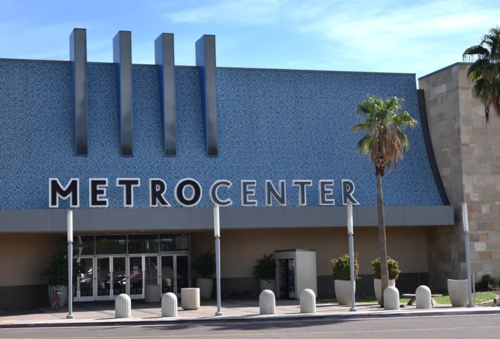 photo of the outside of the front of Metrocenter mall with sign