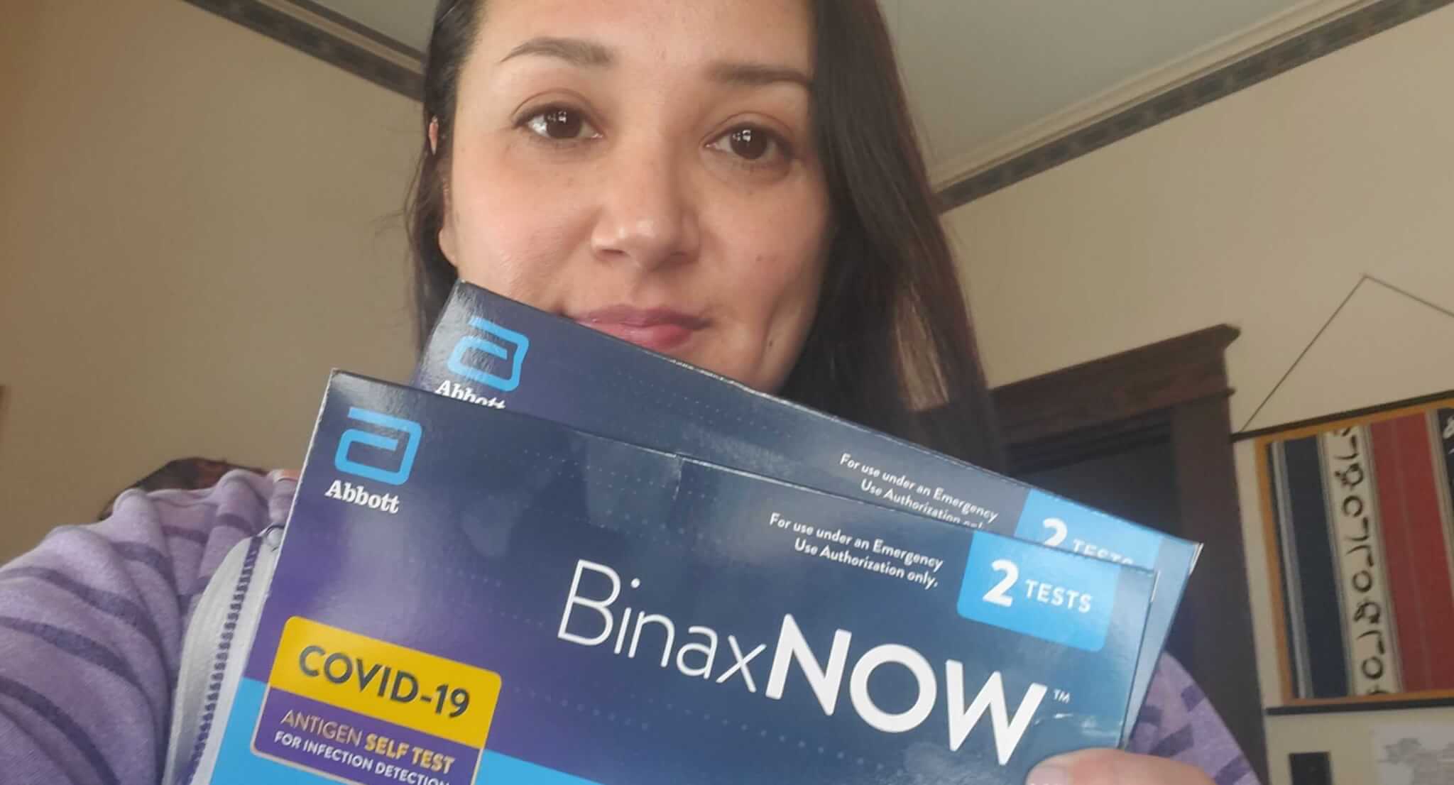 The Copper Courier's Araceli Cruz holding the COVID-19 rapid tests she received in the mail.