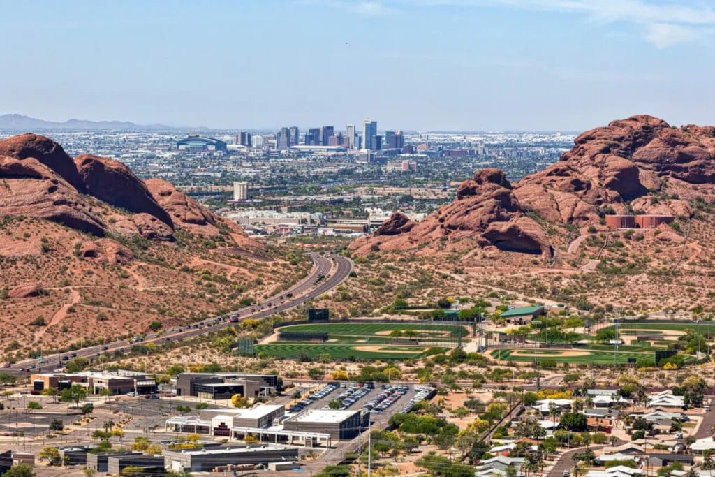 far away shot of downtown Phoenix through the Papago buttes
