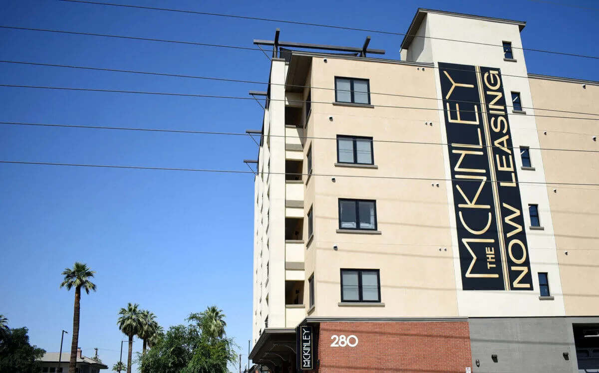 The McKinley apartments with a now leasing sign