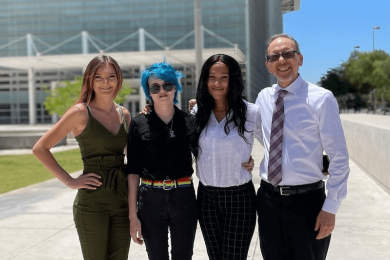 four people posing in front of the US district courthouse in Phoenix