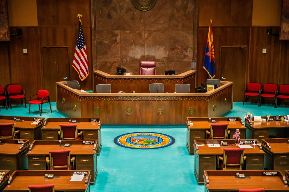 desks for legislators and a large desk facing the others