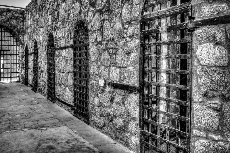 Black and white photo of jail cells at Yuma Territorial Prison