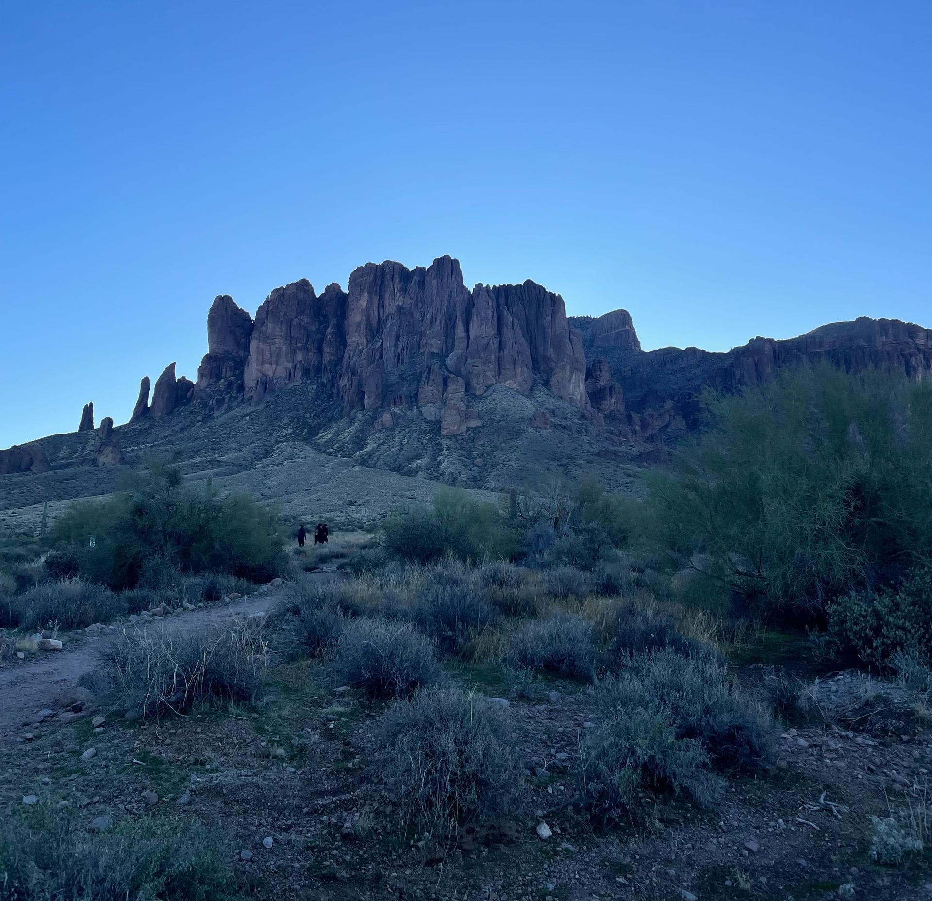 blue sky with mountains and desert landscape