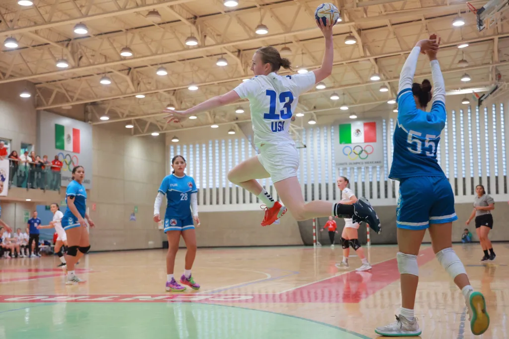 viva kris playing handball with Team USA jersey on