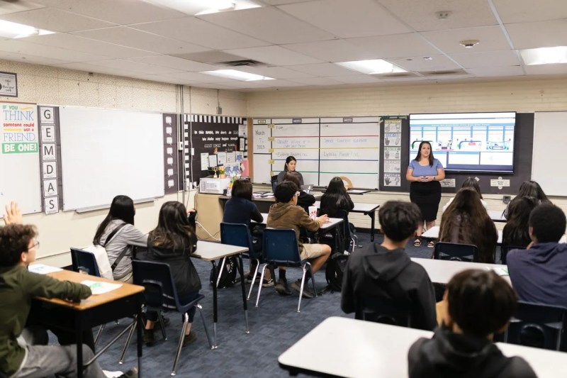 group of students sitting at desks in classroom