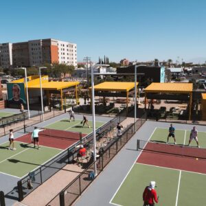 People playing pickleball in pickleball courts.