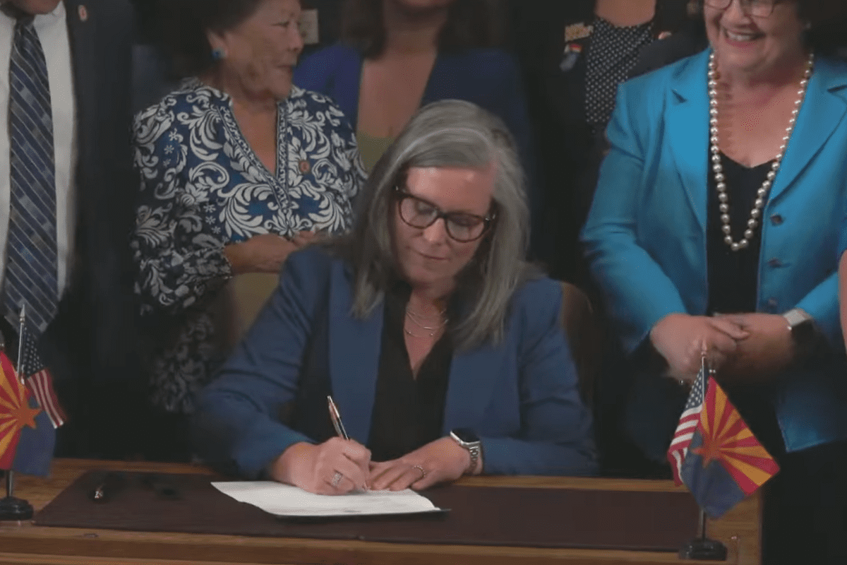 Arizona’s Democratic governor signs a bill to repeal 1864 ban on most abortions