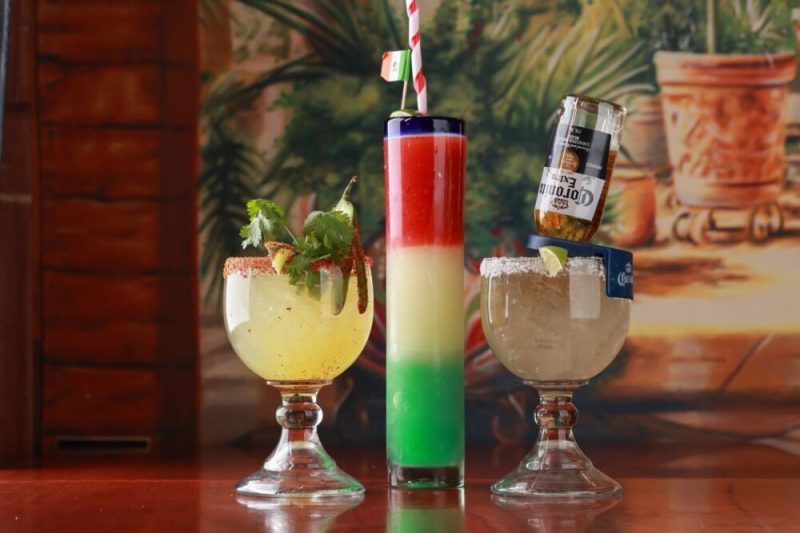 Three colorful and fancy margaritas on a bar at Guadalajara Grill in Tucson