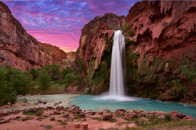 The waterfall at Lake Havasu at sunset. Our readers named Lake Havasu one of the best budget-friendly vacations in Arizona.