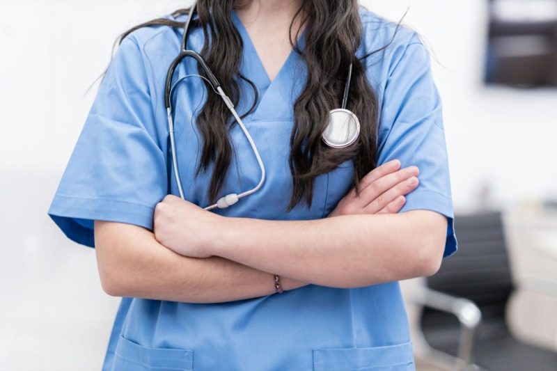 Female nurse with her arms crossed over her chest.