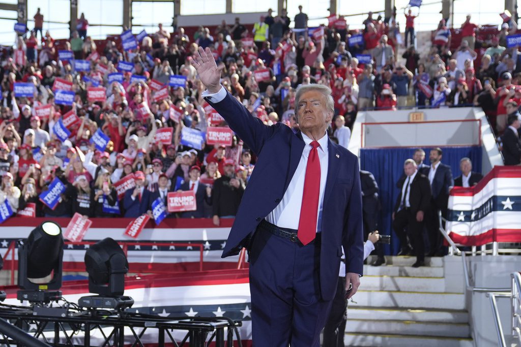 Republican presidential nominee former President Donald Trump waves as he wraps up a campaign rally at J.S. Dorton Arena, Monday, Nov. 4, 2024, in Raleigh, N.C. (AP Photo/Evan Vucci)