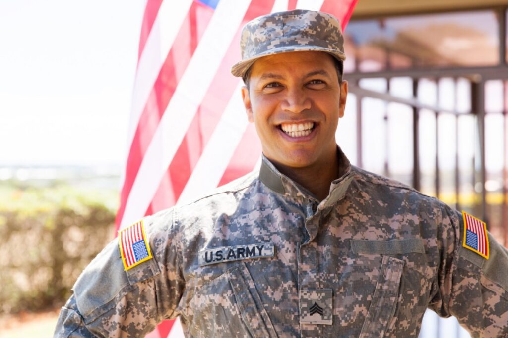 portrait of happy us army soldier outdoors.