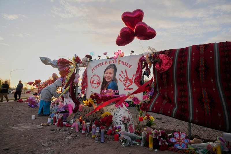 A tribute to slain Native American teen Emily Pike adorns a fence near a vigil in her honor in Mesa.