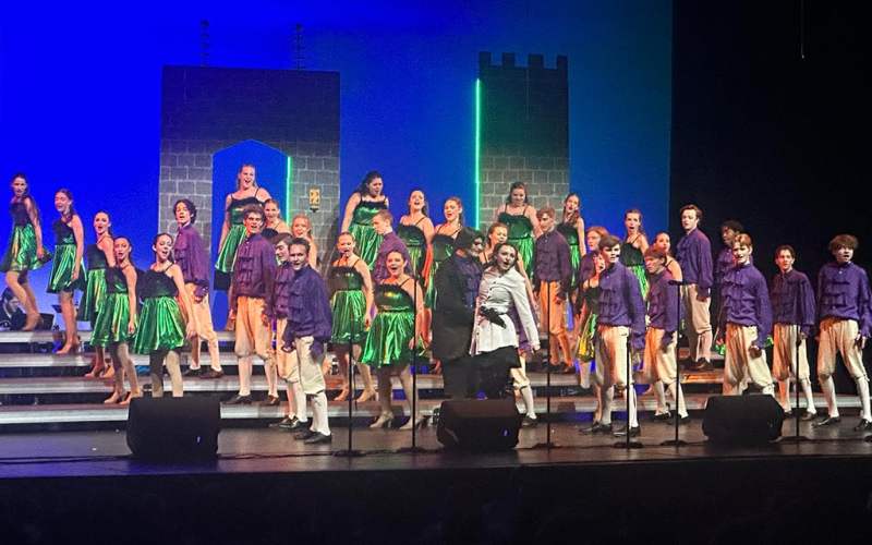 a show choir performing on stage