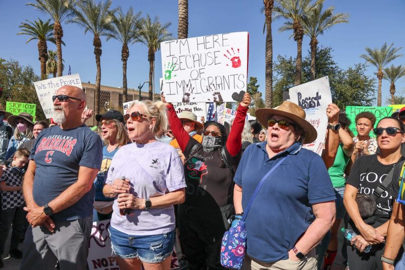 people holding protest signs