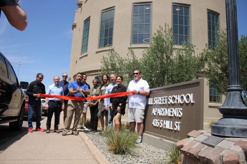 Globe Mayor Al Gameros cuts the ribbon at the grand opening of the Hill Street School Apartments