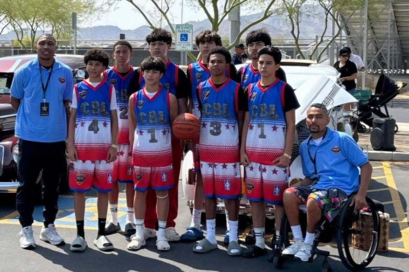 group of boys basketball players with two adults
