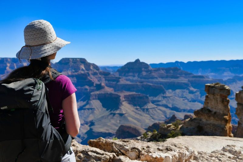 Female hiker overlooks the Grand Canyon