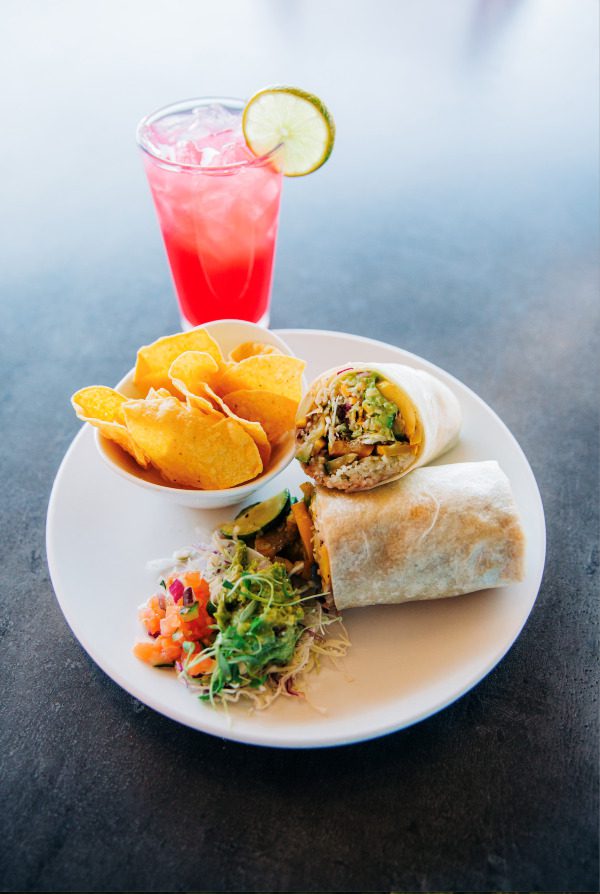 A plate of tacos and a pink drink at Seis Kitchen in Tucson