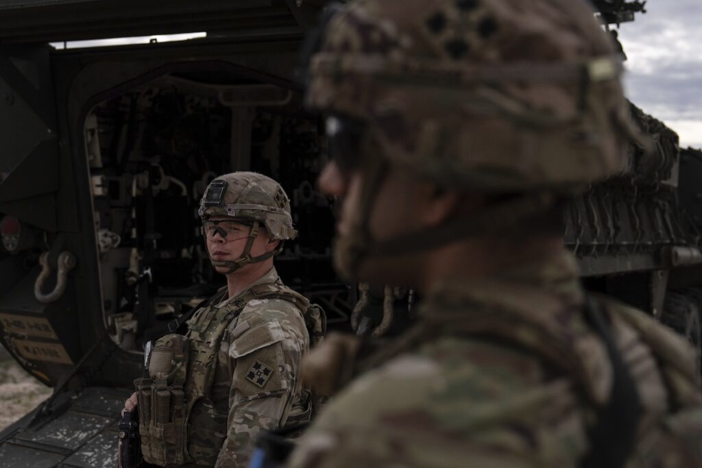 two border agents in camouflage
