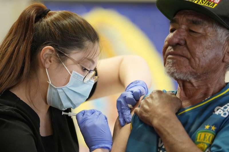 woman giving man a shot