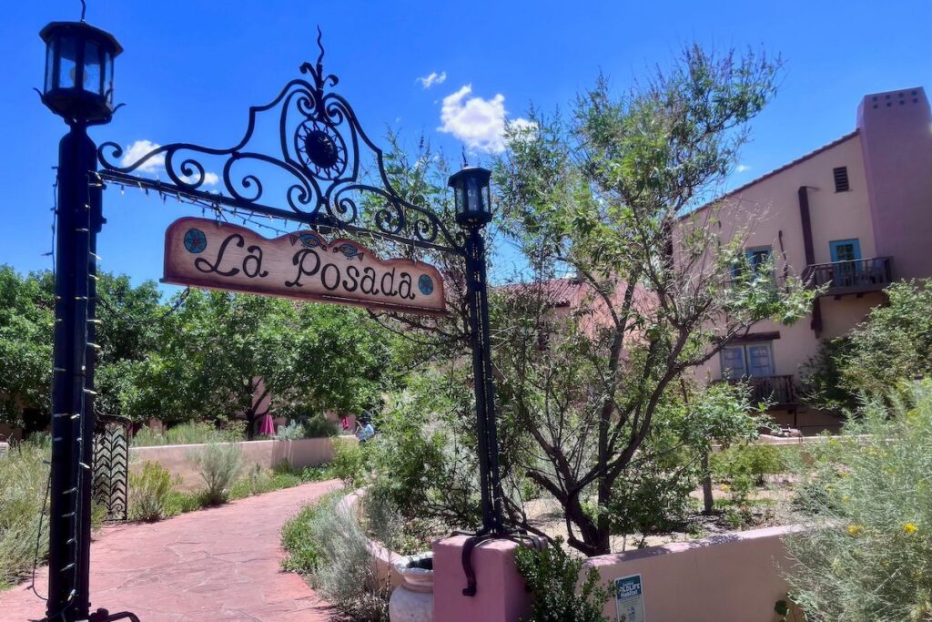 entrance to a hotel and sign that says La Posada
