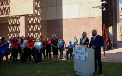 Families with disabled children rally to protest Arizona’s cuts to disability services