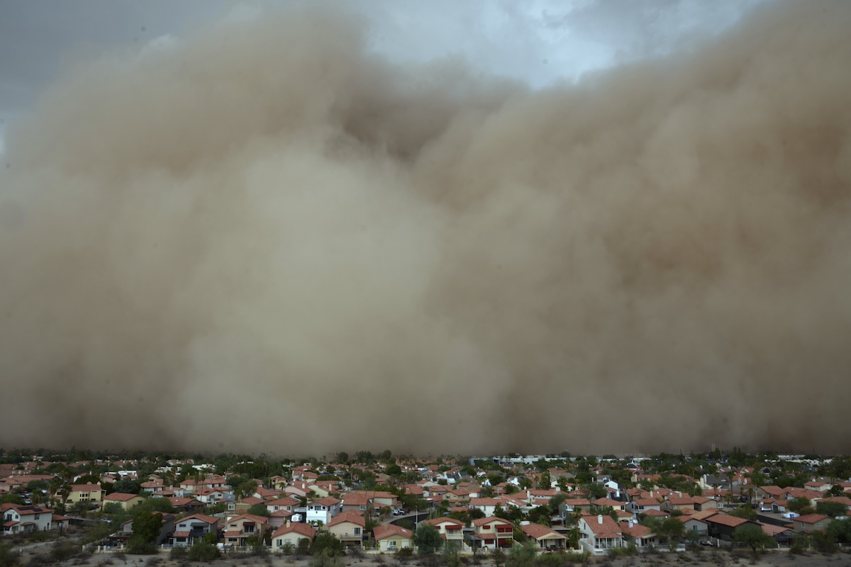 giant dust cloud moving over top a neighborhood