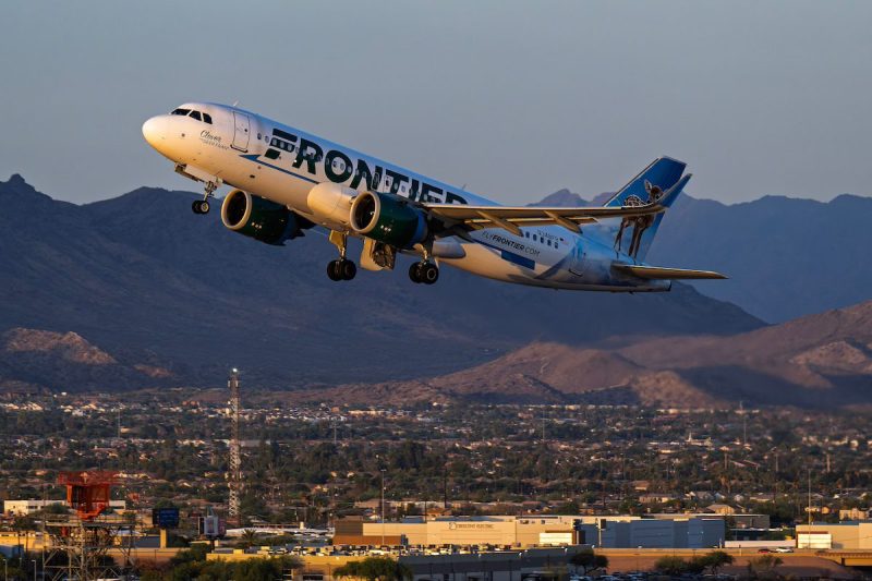 Frontier airplane taking off at Phoenix airport