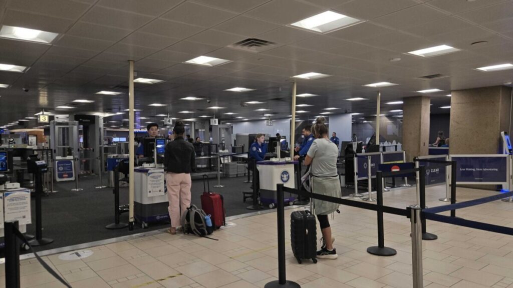 Travelers line up to go through security at Phoenix Sky Harbor International Airport