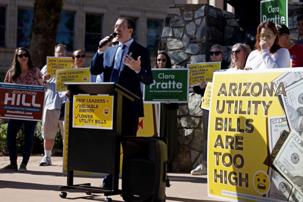 Jonathon Hill, candidate for the Arizona Corporation Commission, speaks at a news conference