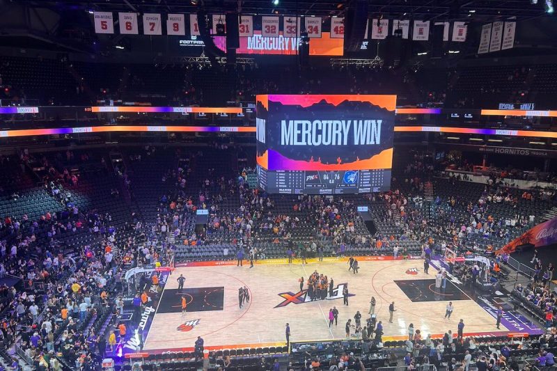 inside of a basketball arena with a sign that says Mercury win