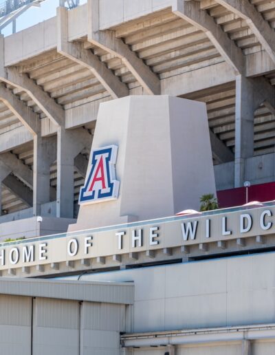 outside of football stadium showing U of A logo and Home of the Wildcats