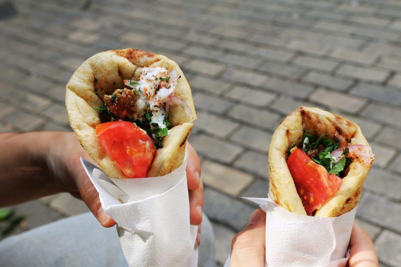 people holding gyros