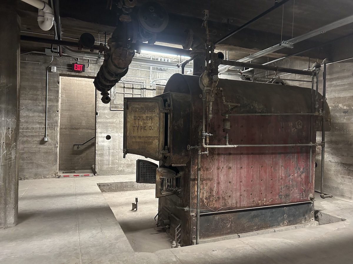 old boiler in center of basement