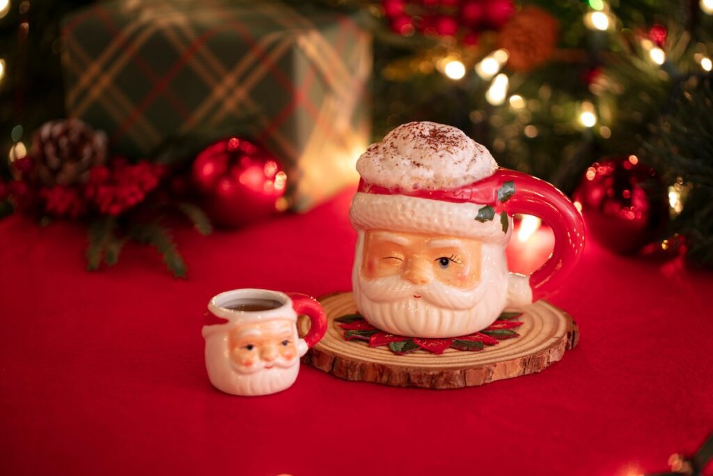 cocktail in a Santa mug and shot glass