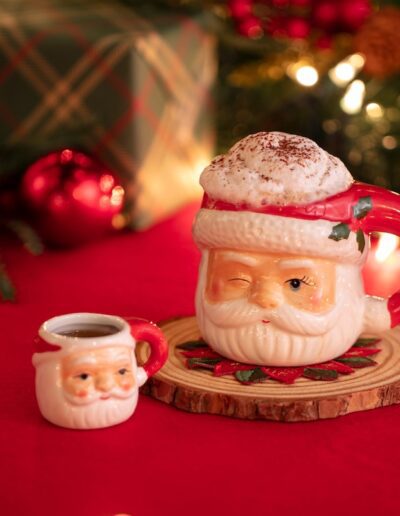 cocktail in a Santa mug and shot glass