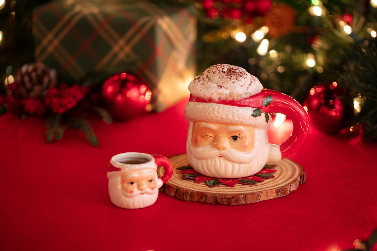 cocktail in a Santa mug and shot glass