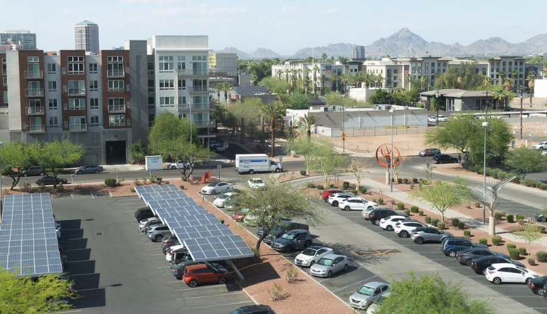Looking out across a carpark towards an office tower and apartment building downtown Phoenix.